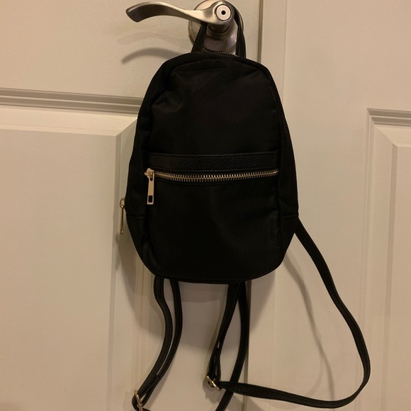a new day Handbags - Mini Backpack, shiny polyester material